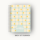 Plaid planner with star patterns on a white background