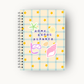 Home school planner with a checkered design and beach-themed stickers on a white background